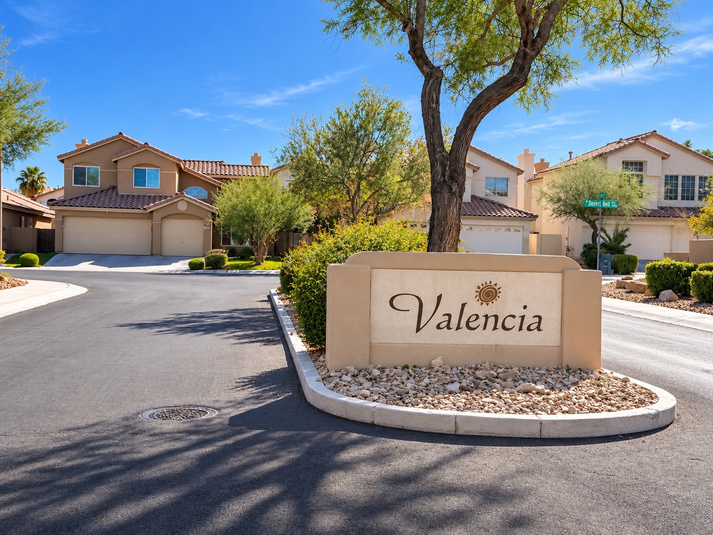 Valencia neighborhood entrance sign and tile-roof homes in The Pueblo, Summerlin, Las Vegas 89128